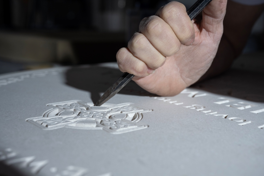 Celtic cross carving stone mason carving a celtic cross